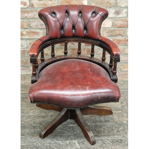 1261 - 20th century leather button back swivel office chair with studded edging and gallery back, H 81cm