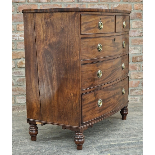 1267 - 19th century mahogany bow front chest of two short over three long drawers, raised on turned support... 