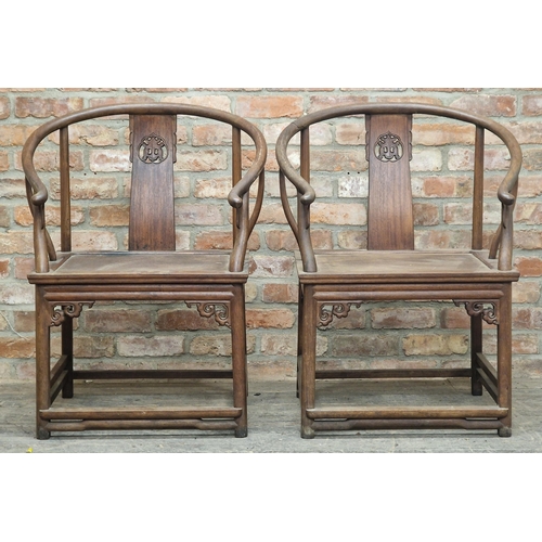 1283 - Pair of antique Chinese elm horseshoe chairs with carved detail, stamped 'Charlotte Horstmann, Hong ... 