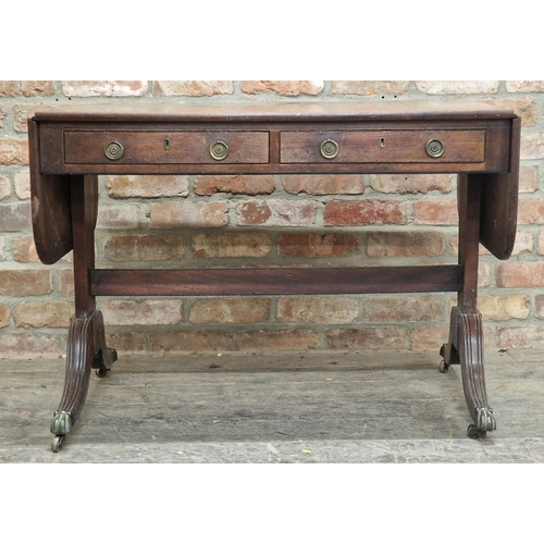 1288 - 19th century mahogany drop leaf sofa table fitted with two sliding and two dummy drawers, raised on ... 