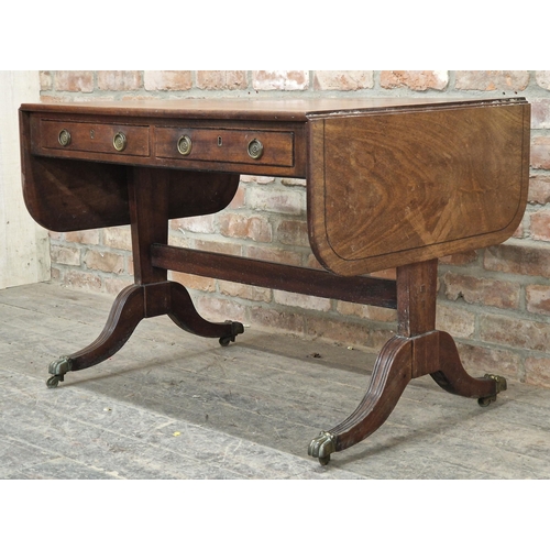 1288 - 19th century mahogany drop leaf sofa table fitted with two sliding and two dummy drawers, raised on ... 