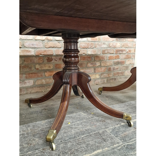 1289 - Good quality 19th century mahogany and satinwood inlaid three pillar dining table, raised on quadrup... 