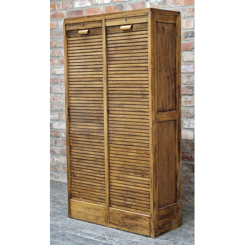 1302 - Vintage 20th century oak double tambour fronted filing cabinet with key, H 150cm x W 81cm x D 35cm