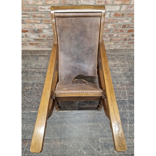 1311 - 20th century Dutch Colonial teak plantation chair with leather seat, H 95cm (AF)