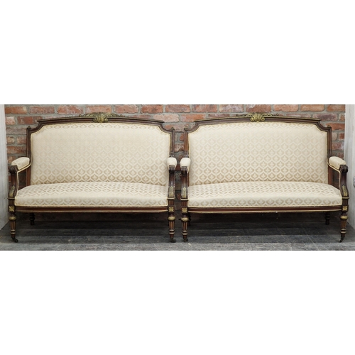 1320 - A good quality pair of 19th century French mahogany and giltwood sofas, raised on turned supports, H... 