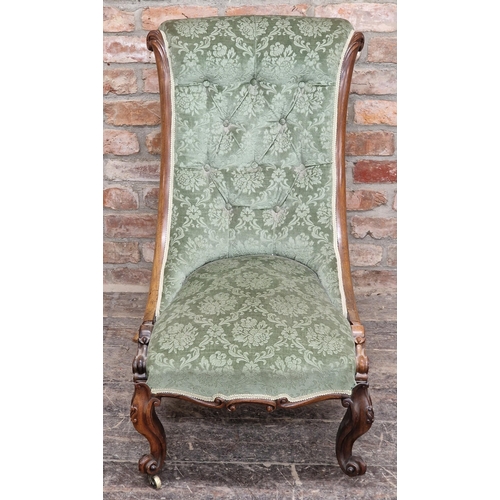 1328 - Victorian walnut button back nursing chair with carved detail, raised on cabriole forelegs, H 89cm