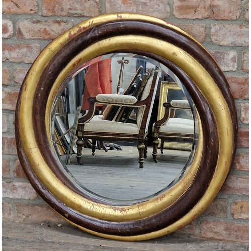 1434 - Gilt wood oval wall mirror with bevelled edge glass, 84cm diameter