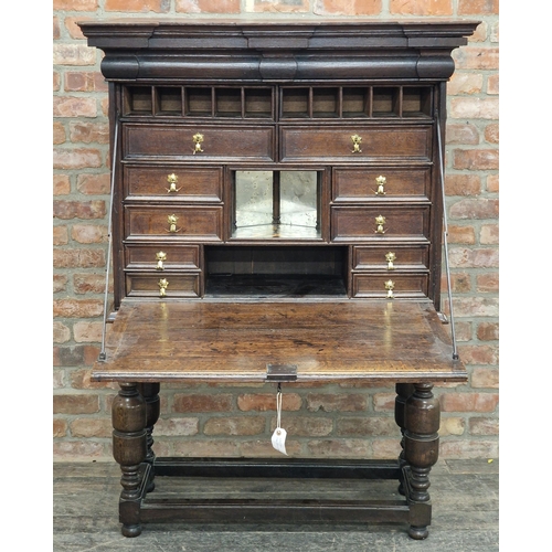 1333 - Good quality Jacobean oak escritoire, the fall front revealing a fitted interior with an arrangement... 