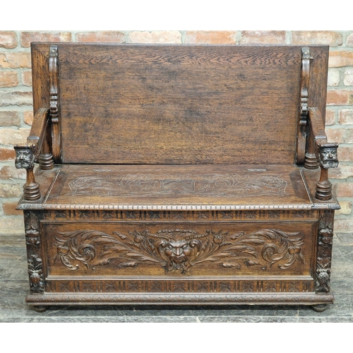 1334 - Good 19th century oak Monks Bench with box seat, profusely carved detail throughout depicting bearde... 