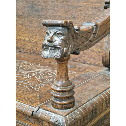 1334 - Good 19th century oak Monks Bench with box seat, profusely carved detail throughout depicting bearde... 