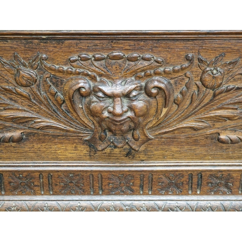 1334 - Good 19th century oak Monks Bench with box seat, profusely carved detail throughout depicting bearde... 