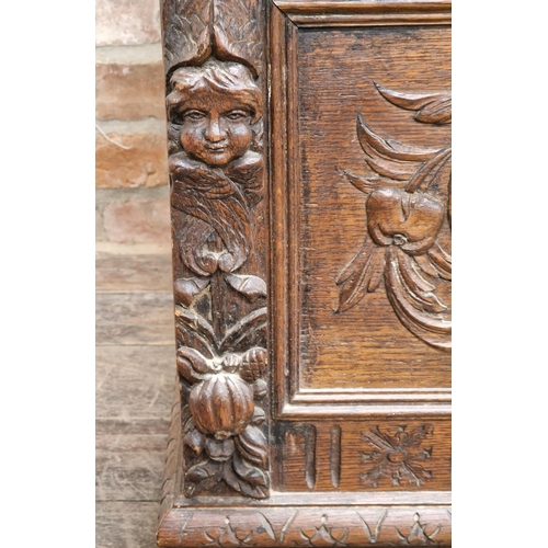 1334 - Good 19th century oak Monks Bench with box seat, profusely carved detail throughout depicting bearde... 