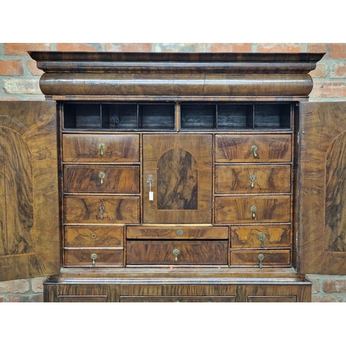 1335 - Exceptional quality Queen Anne walnut cabinet, the twin cupboard doors revealing a fitted interior w... 