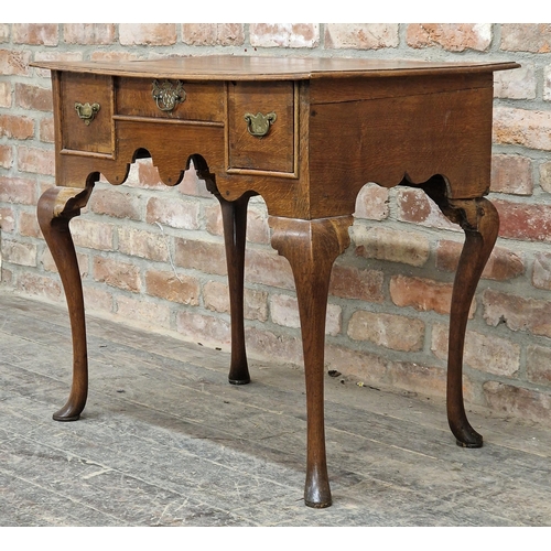 1347 - Georgian oak lowboy fitted with three drawers raised on cabriole legs, H 70cm x W 78cm x D 52cm