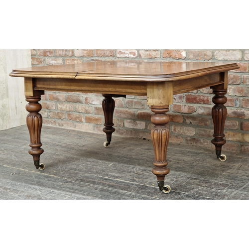 1349 - Victorian mahogany extending dining table raised on turned supports with ceramic castors and single ... 