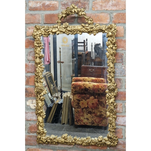 1441 - 20th century gilt wall mirror profusely decorated with scrolling flowers and fruit, H 100cm x W 60cm