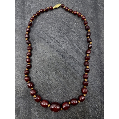 109 - Vintage cherry amber Bakelite graduated bead necklace, silver gilt clasp, 55cm long, 32g