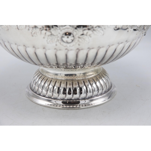 156 - Large silver plate punch bowl with lion head handles and repoussé foliage, raised atop circular foot... 