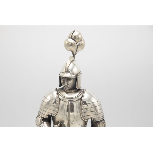 192 - Well modelled early 20th century silver figure of a standing knight, in traditional armour with swor... 