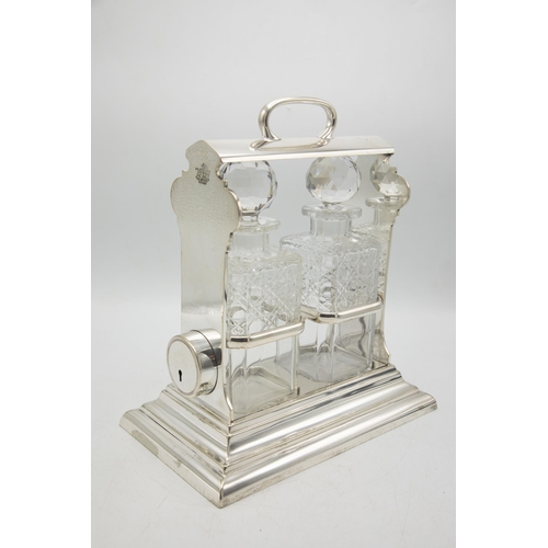 199 - Good quality Walker & Hall 'Holdfast' silver plate tantalus, fitted with two cut glass square decant... 