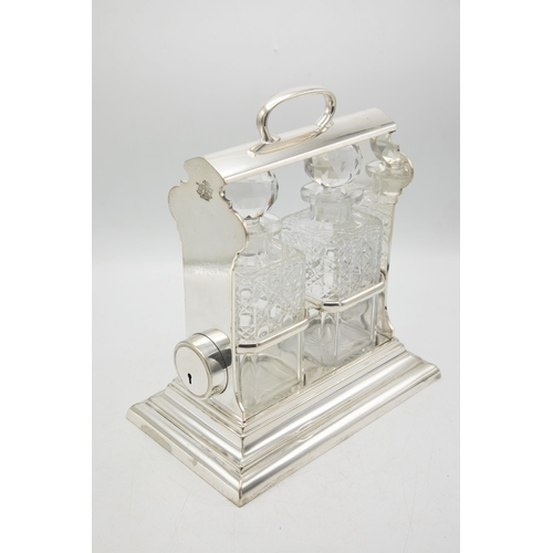 199 - Good quality Walker & Hall 'Holdfast' silver plate tantalus, fitted with two cut glass square decant... 