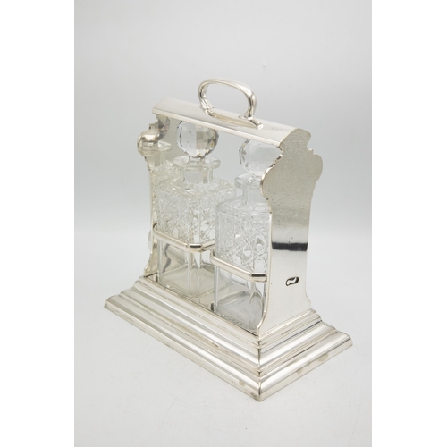 199 - Good quality Walker & Hall 'Holdfast' silver plate tantalus, fitted with two cut glass square decant... 