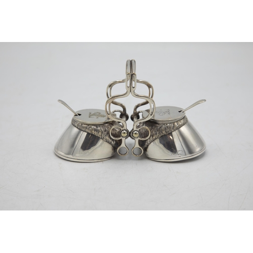 206 - Hunting Interest - Novelty silver plate twin cruet in the form of horses hooves, with bridle tack ha... 