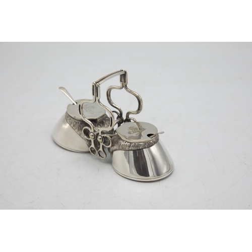 206 - Hunting Interest - Novelty silver plate twin cruet in the form of horses hooves, with bridle tack ha... 