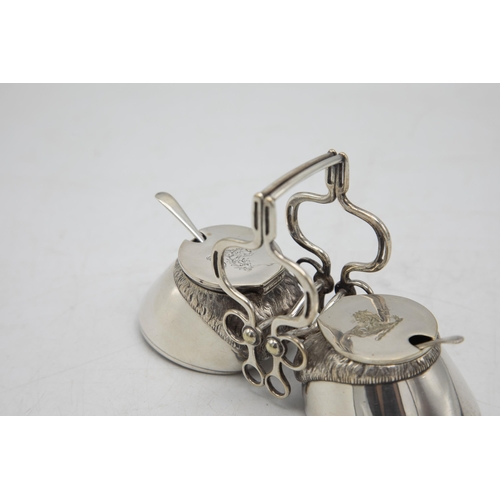 206 - Hunting Interest - Novelty silver plate twin cruet in the form of horses hooves, with bridle tack ha... 