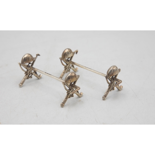 207 - Polo Interest - Novelty pair of equestrian spoon rests, with hat, crop, whip and stirrup detail, mak... 