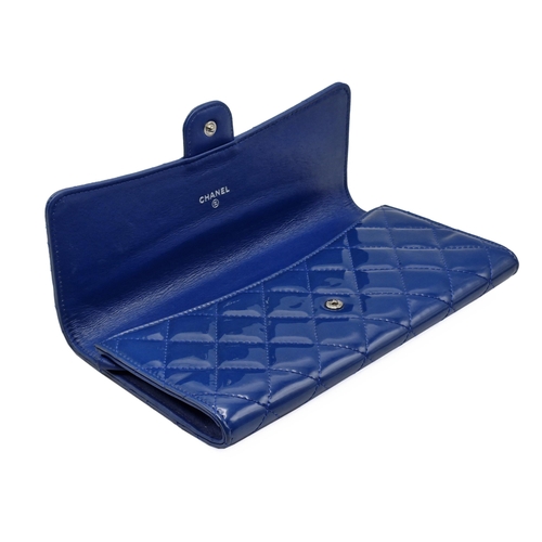 281 - Chanel blue leather shiny clutch bag with cash wallet, card holder and passport cover, to include or... 