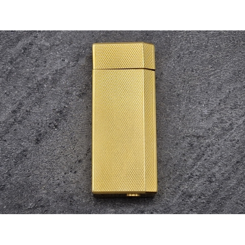 256 - Les Must De Cartier Gold Plate Briquet Lighter, to include box, authentication and additional flints