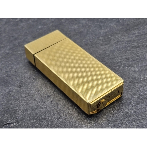 256 - Les Must De Cartier Gold Plate Briquet Lighter, to include box, authentication and additional flints