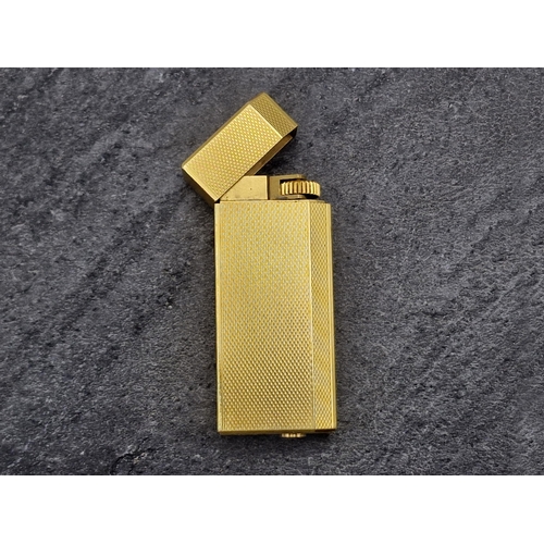 256 - Les Must De Cartier Gold Plate Briquet Lighter, to include box, authentication and additional flints