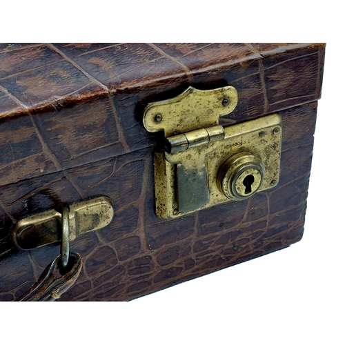 293 - Vintage faux crocodile skin briefcase with brass clasps, having original key, 35cm x 23cm x 9cm