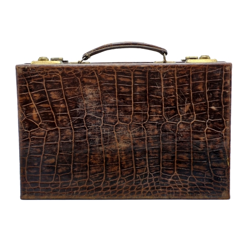 293 - Vintage faux crocodile skin briefcase with brass clasps, having original key, 35cm x 23cm x 9cm