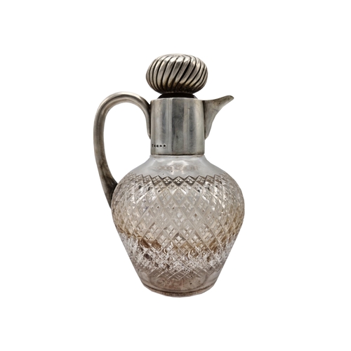 234 - Georgian silver and cut glass claret jug, the flute stopper with turn lock and pourer, 23cm high