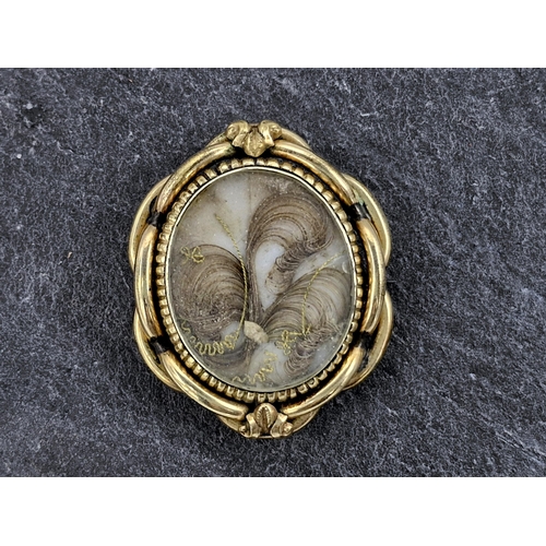 146 - Victorian pinchbeck swivel mourning brooch, fitted with a fan of hair, 5.5 x 4.5cm, 27.6g