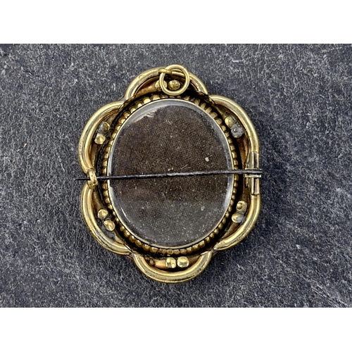 146 - Victorian pinchbeck swivel mourning brooch, fitted with a fan of hair, 5.5 x 4.5cm, 27.6g