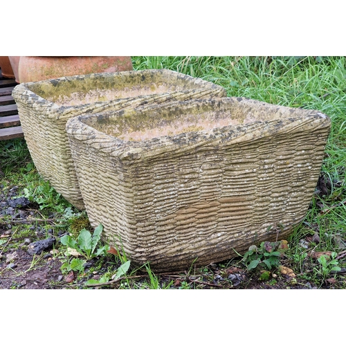 1009 - Pair of weathered reconstituted stone garden planters in the form of baskets stamped Arveci Products... 