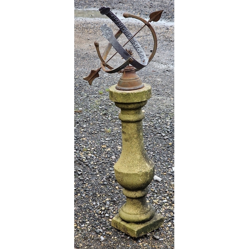 1011 - Iron armillary sphere raised on a reconstituted stone pedestal, H 90cm