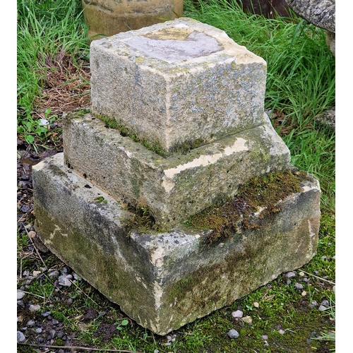 1015 - Weathered natural stone three tiered plinth, H 40cm x W 36cm