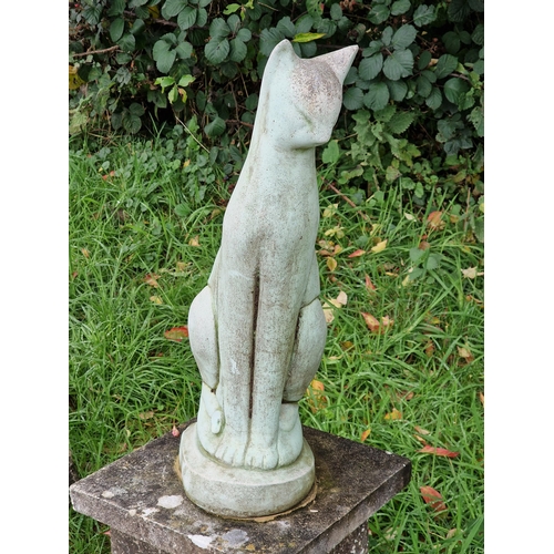 1025 - Reconstituted stone garden ornament of a Siamese cat raised on an associated plinth, H 90cm