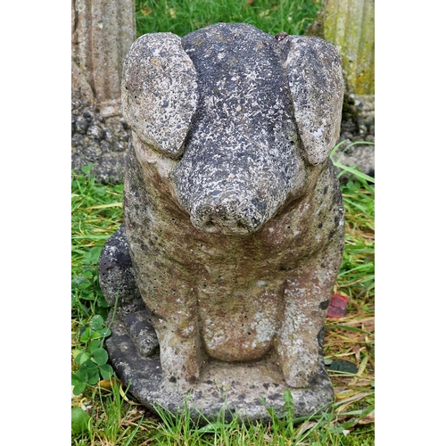 1027 - Weathered reconstituted stone garden ornament of a pig, H 40cm