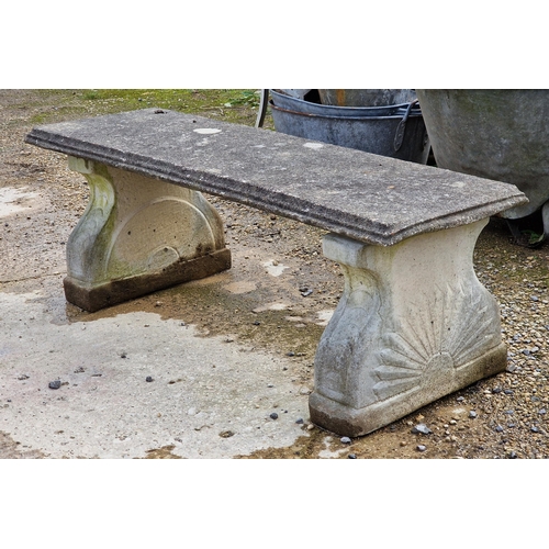 1041 - Weathered reconstituted stone pedestal garden bench with sunburst detail, H 42cm x W 122cm x  D 42cm