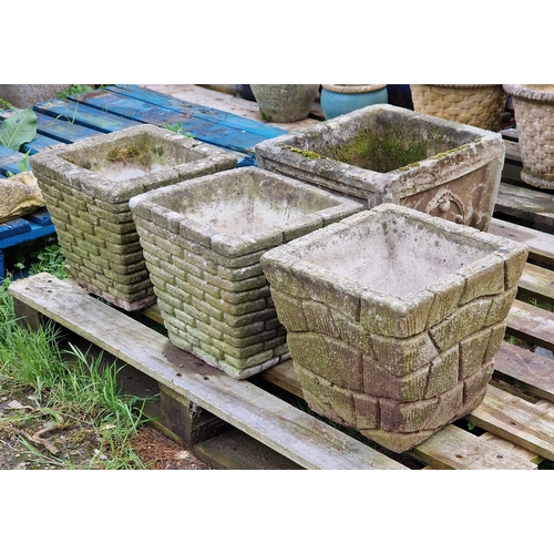 1049 - Four various weathered reconstituted stone garden planters of tapered form (4)