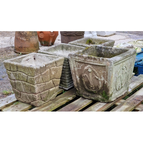 1049 - Four various weathered reconstituted stone garden planters of tapered form (4)