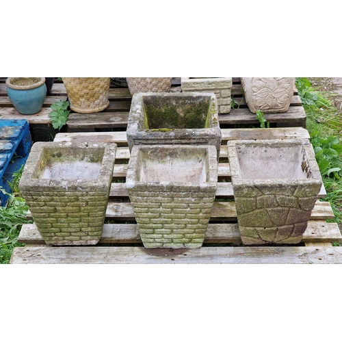 1049 - Four various weathered reconstituted stone garden planters of tapered form (4)