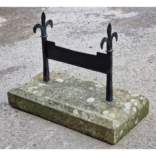 1059 - Antique painted iron boot scraper set in a chamfered stone block, H 45cm x W 61cm x D 32cm