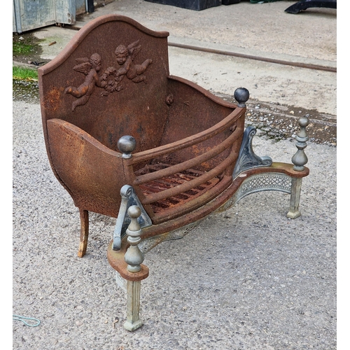 1061 - Antique cast iron fire basket with cherub relief and pierced detail, H 51cm x W 67cm x D 32cm